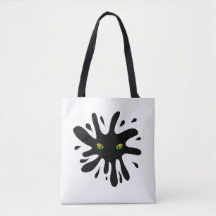 Katzenaugen mit Blick auf einen schwarzen Block Tasche