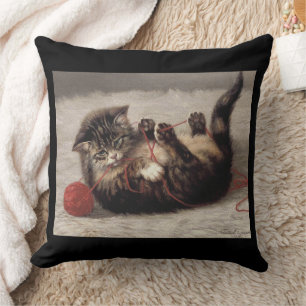 Katzenklatsche, eine Katze, die Galle aus dem Garn Kissen