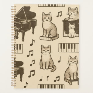Katzenplaner auf einem verblassten Klavier Planer