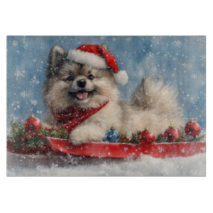Keeshond-Hund im Schlitten Lass es schneien Weihna Schneidebrett