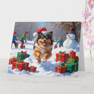 Keeshond-Hund läuft im Schnee mit Weihnachtsmütze Karte