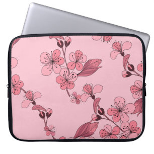 Kirschblüte in rosa Farbe auf weißem Hintergrund. Laptopschutzhülle
