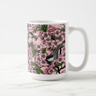 Kirschblüte und Kichererbsen auf rosa Kaffeetasse