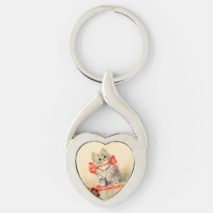 Kitten mit einem roten Band Schlüsselanhänger