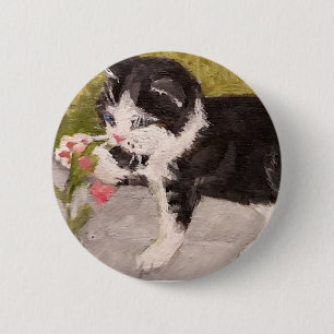 Kitten Playing mit rosa Blume Button