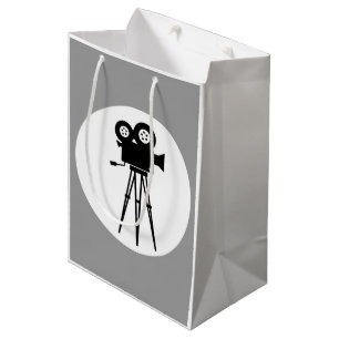 KLASSISCHE KAMERA AUS SCHWARZ UND WEISS MIT TRIPT MITTLERE GESCHENKTÜTE