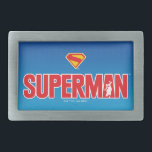 Klassisches Superman Bold-Logo Rechteckige Gürtelschnalle<br><div class="desc">Mit diesem beeindruckenden Superman Design bringen Sie zeitlose Superheldenenergie in Ihren Stil! Mit dem fett roten "SUPERMAN"-Text mit einer Silhouette des Mannes aus Stahl, die heldenhaft in der Schrift dargestellt wird, Pop dieses Kunstwerks gegen einen schmalen Gradientenblauen Hintergrund. Hinter dem imposanten rot-gelben "S"-Schild verbirgt sich eine mächtige Hommage an DCs...</div>