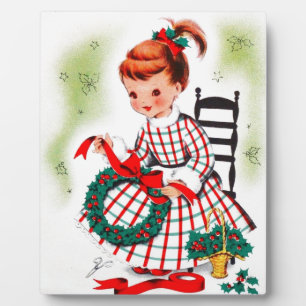 Klassisches Weihnachtsmädchen mit Kranzribonen Fotoplatte