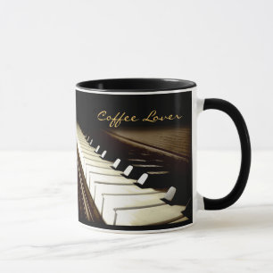 KLAVIER BEFESTIGT Musik-Liebhaber trinkende Tasse