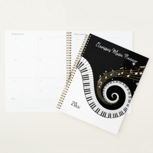 Klaviertasten und Gold-Musiknoten Planer