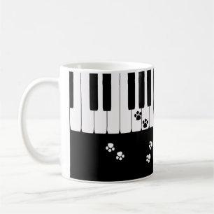 Klaviertasten und Katzenfußpfoten Tasse