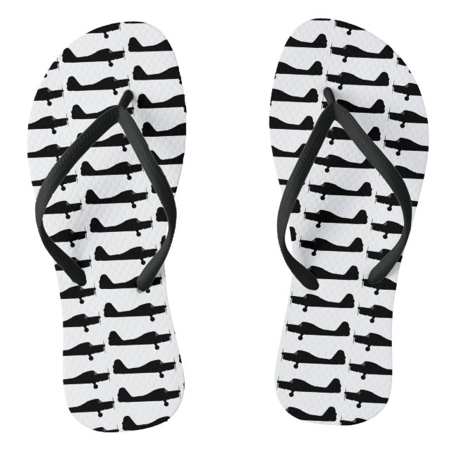 Kleine Flugzeug-Silhouette drehen Reinfälle um Flip Flops (Fußbett)