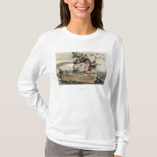 Kleine Mädchen, die ein Geschenk und einen Baum T-Shirt