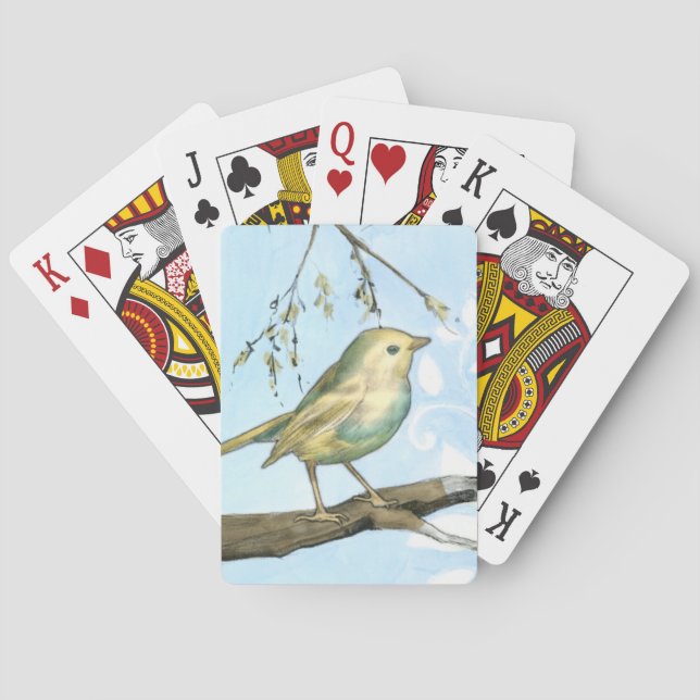 Kleiner gelber Vogel hockte auf einer Spielkarten (Rückseite)