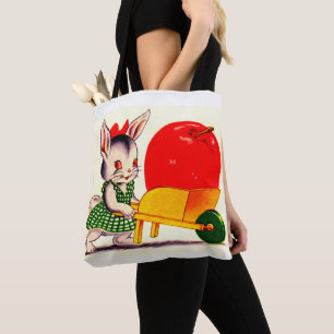 kleiner Hase, der einen Wagen mit einem großen Apf Tasche