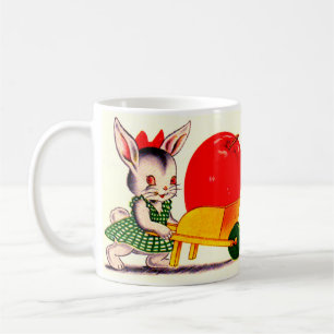 kleiner Hasen, der mit einem großen Apfel den Wage Kaffeetasse