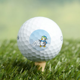 Kleiner Pinguin mit schneebedeckten Kugeln Golfball