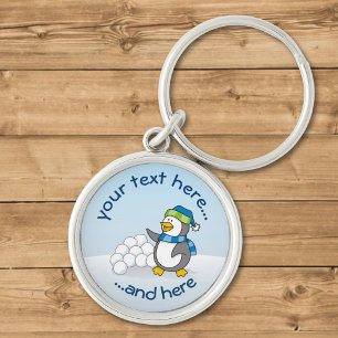 Kleiner Pinguin mit schneebedeckten Kugeln Schlüsselanhänger