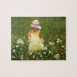 Kleines Mädchen auf dem Gebiet der Blume