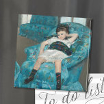 Kleines Mädchen in einem blauen Sessel | Mary Cass Magnet<br><div class="desc">Little Girl in a Blue Sessel (1878) von Mary Cassatt ist ein beeindruckendes Porträt eines jungen Mädchens, das sich in einem übergroßen blauen Sessel niederlässt. Das Gemälde erfasst einen Moment der Entspannung, wobei das Kind sich locker anlehnt und ein Gefühl jugendlicher Leichtigkeit ausstrahlt. Die blauen Farbtöne des Stuhls kontrastieren wunderschön...</div>