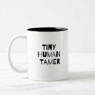 Kleines menschliches zahmeres zweifarbige tasse