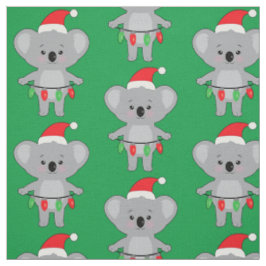 Koala in Weihnachtsmannmütze und Weihnachtsdekorat Stoff