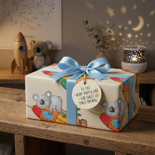 Koala schlafen bei einer farbenfrohen Rakete Geschenkpapier