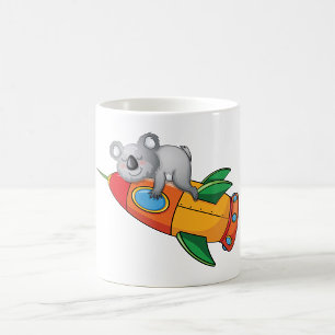 Koala schlafen bei einer farbenfrohen Rakete Kaffeetasse