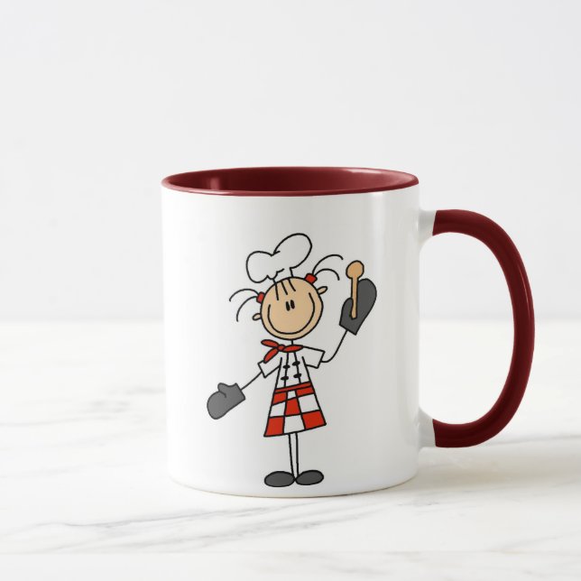 Kochs-Mädchen mit der hölzernen Löffel-Tasse Tasse (Rechts)