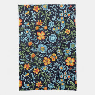 Komplizierte Blumenkunst: Blaue und orangefarbene Geschirrtuch