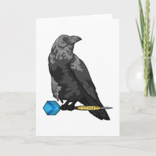 Krähe beim Dartsspielen mit Dart Karte