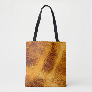 Kratzen auf metallischem goldfarbenem Hintergrund. Tasche