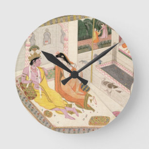 Krishna und Radha auf einem Bett in einem Runde Wanduhr