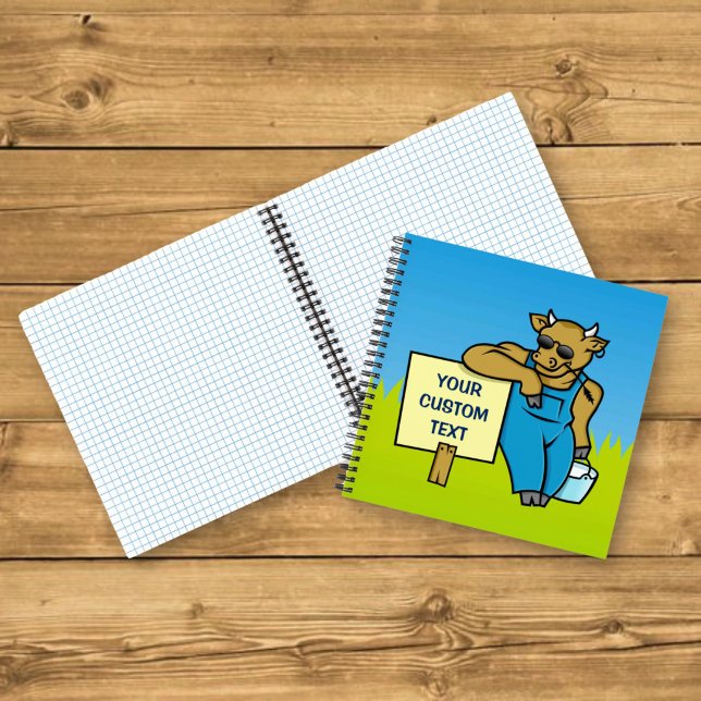 Kuh mit Schild Notizbuch (Von Creator hochgeladen)