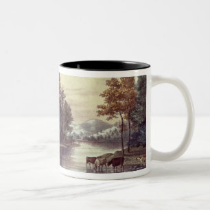 Kühe auf dem Ufer von einem See Zweifarbige Tasse