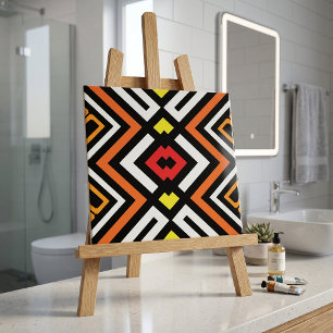Kühnes geometrisches Aztekenmuster in Orange und S Fliese