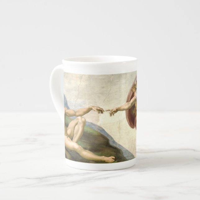 La création d'Adam par la tasse de Michaël Angelo (Devant gauche)