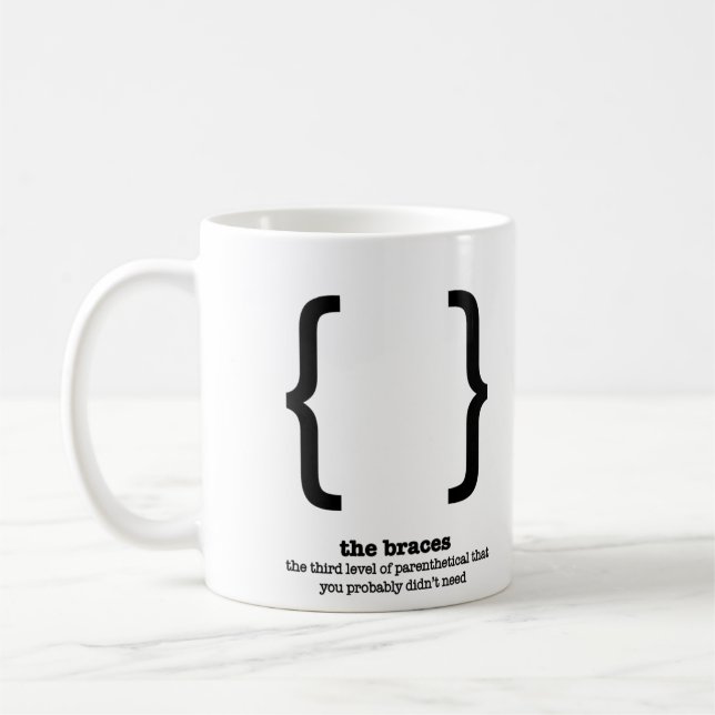 La tasse de grammaire attache la grammaire de (Gauche)