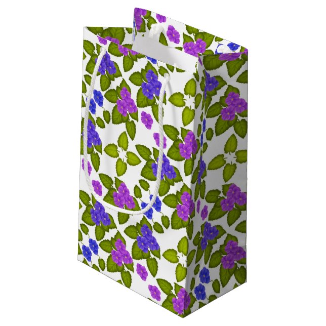 La violette africaine pourpre fleurit le sac de (Dos Angle)