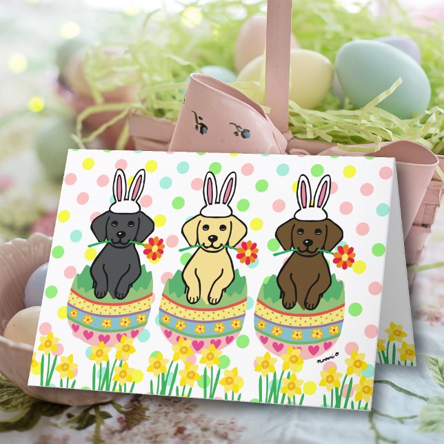 Labrador Puppies Ostereier Feiertagskarte (Labrador Puppies Easter Eggs card featuring Lab Puppies celebrating Easter.  Cute Cartoon Design.  )
