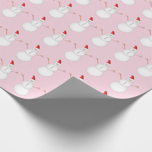 Lächelnde Snowmen, die Weihnachtsmannmützen tragen Geschenkpapier