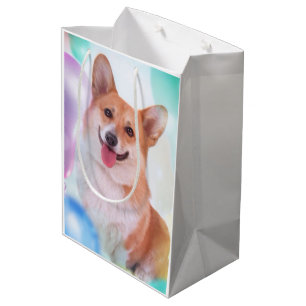 Lächelnder Corgi mit Ballonen Mittlere Geschenktüte