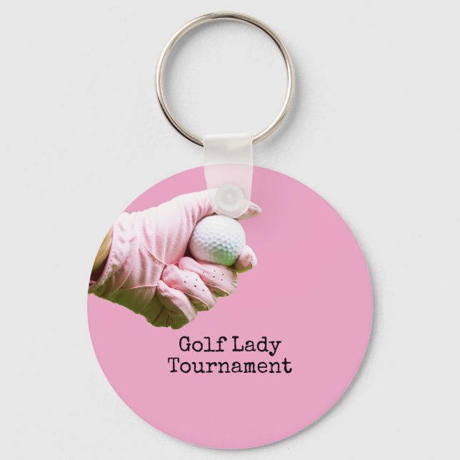 Lady Golfer hält Golfball auf pinklem Hintergrund Schlüsselanhänger (Vorderseite)