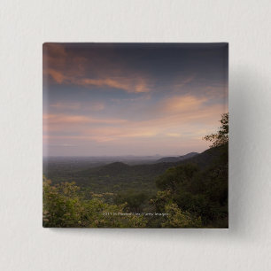 Landschaft unter einem Sonnenuntergang Button