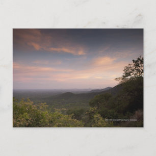 Landschaft unter einem Sonnenuntergang Postkarte