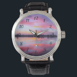 Landschaftlich rosa Landschaft Armbanduhr<br><div class="desc">Schöner rosa Sonnenuntergang über einem ruhigen See mit einer Baumreihe im Hintergrund. Eine schöne Mischung und Mischung von bunten Wolken,  die rosa,  blau,  lila und gelb sind. Phantastische und launische Beleuchtung,  Schatten und Reflexionen.</div>