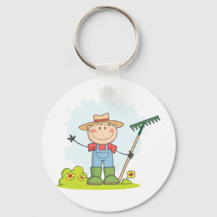 Landwirtschaft des im Garten arbeitenjungen Schlüsselanhänger