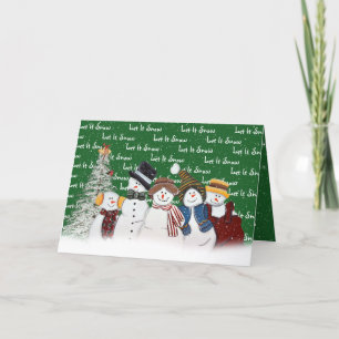 Lass es Schneemänner auf Grün schneebedecken Feiertagskarte