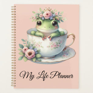 Launiger Frosch in floraler Teetasse Planer