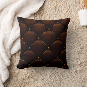 Le brun foncé a orné le coussin simili cuir de
